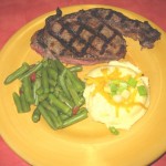 Sandersons Angus Rib Eye - Hand cut, char-grilled ribeye topped with our homemade maison butter with your choice of two sides.